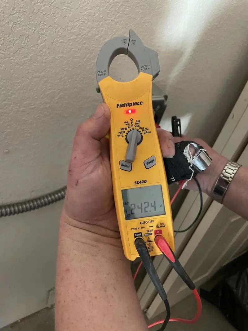 Voltage testing with clamp meter during Recessed Lighting Installation in Crafton
